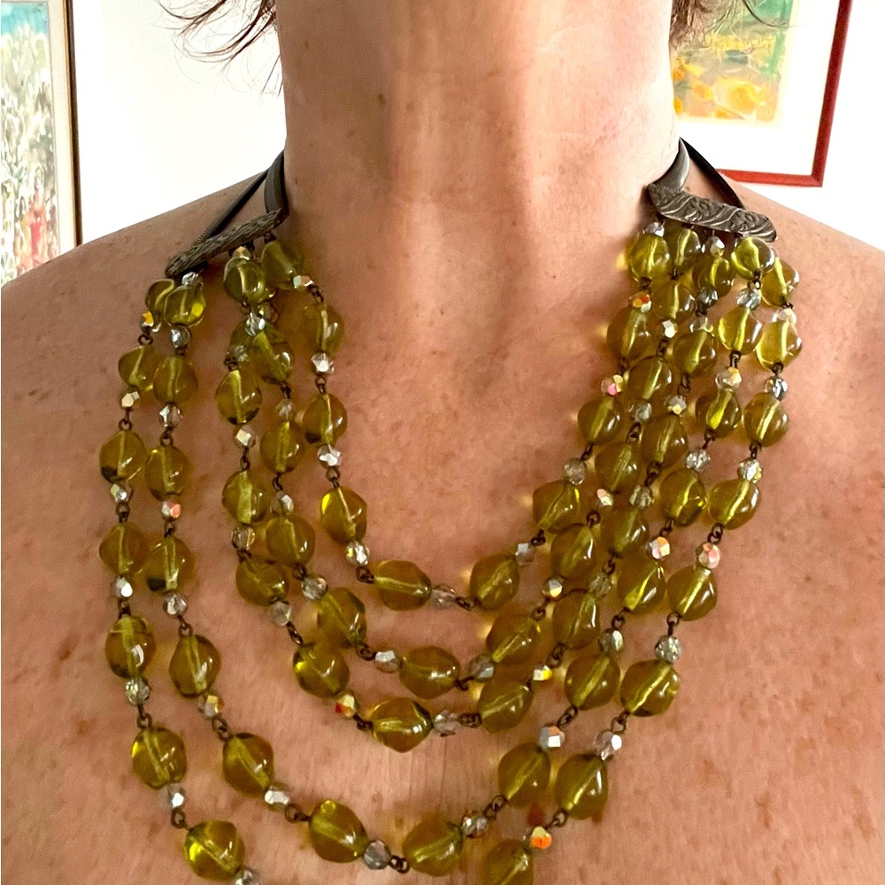 Five strands. Green Crystal with brass.